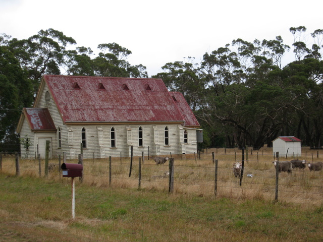 An old church in a sheep paddock